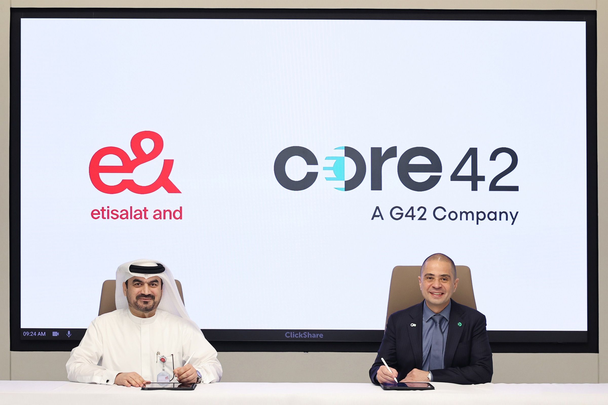 Executives from e& UAE and Core42 signing a partnership agreement