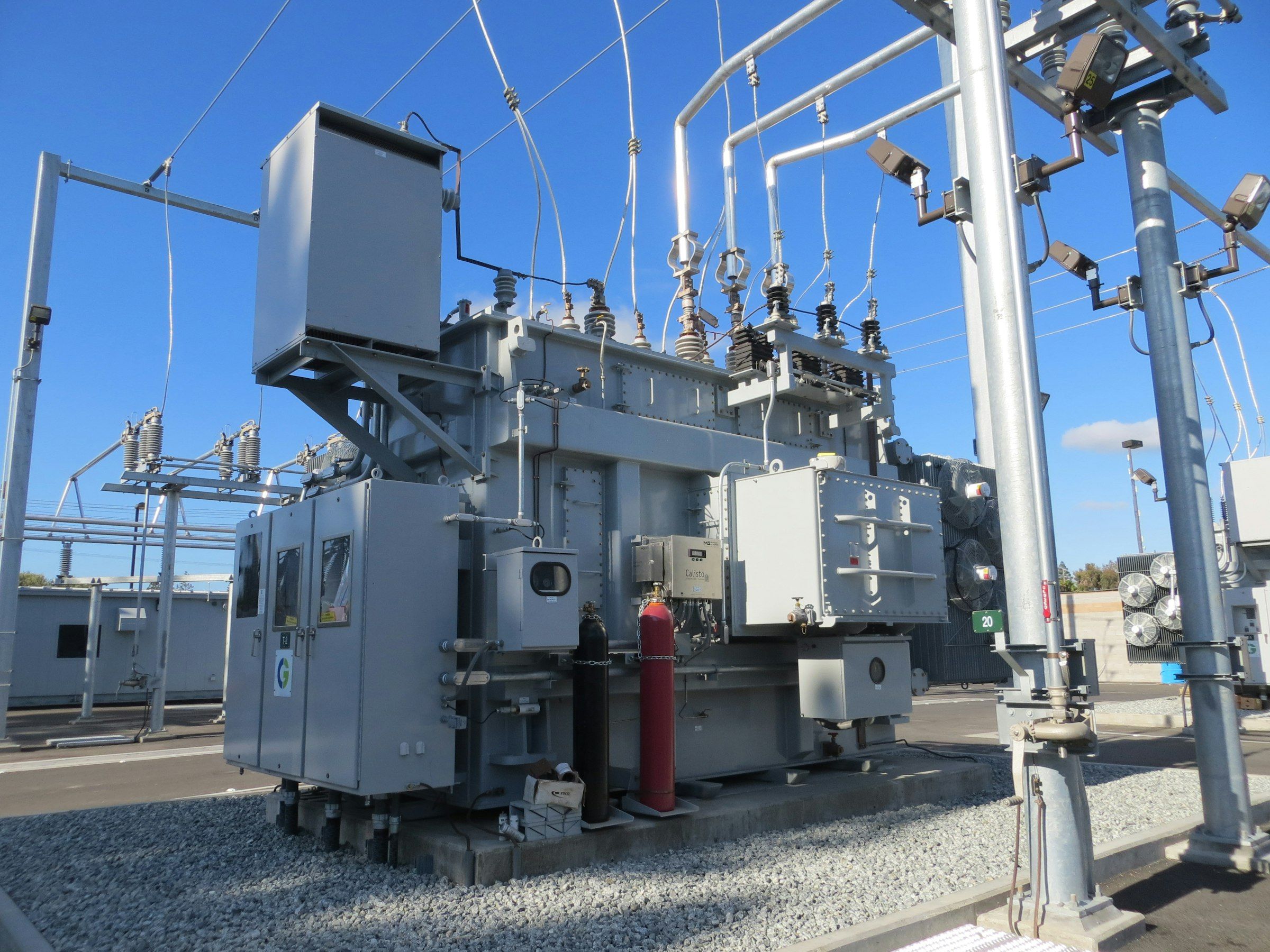 A large grey power transformer in an electrical substation