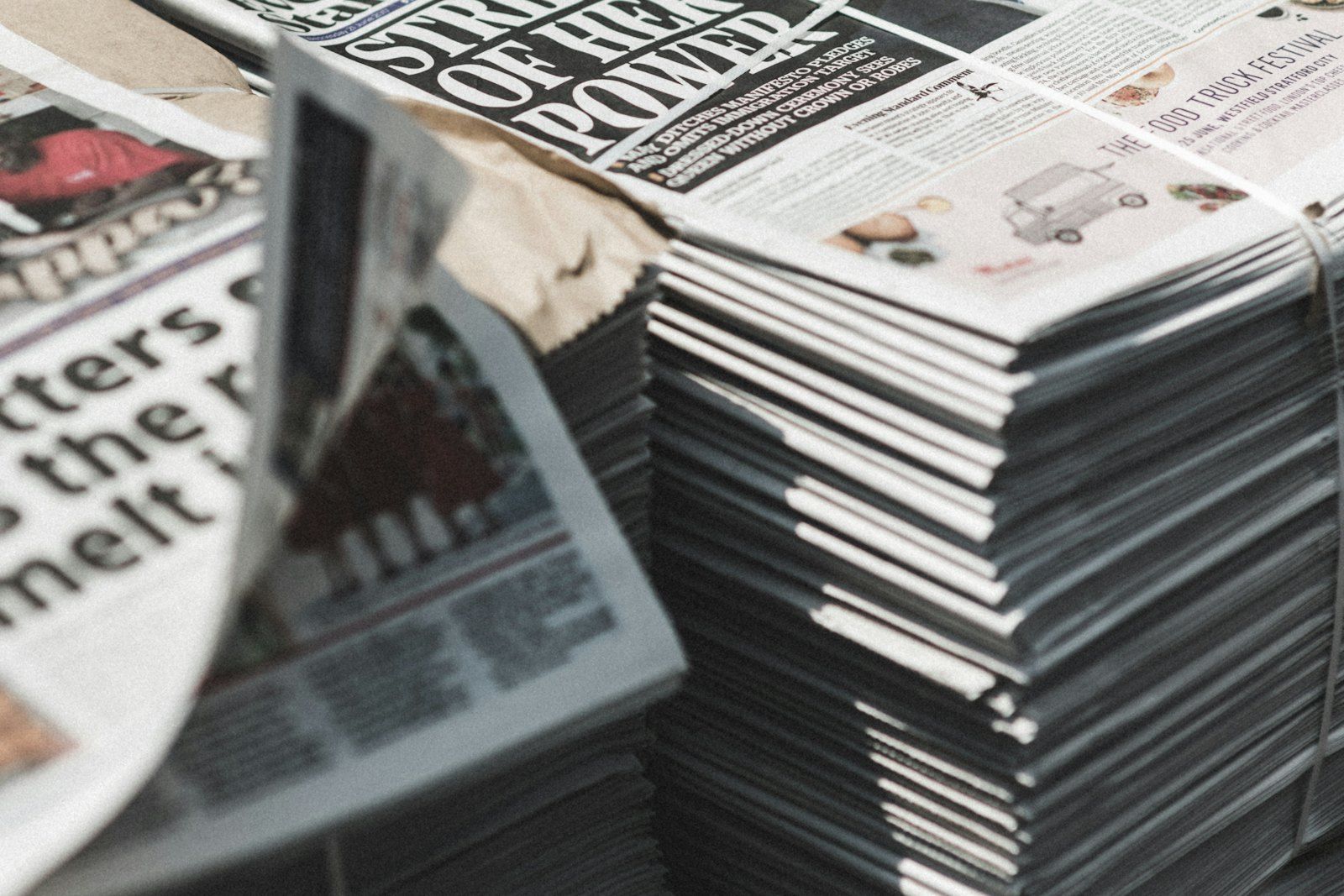 Bundled stacks of printed newspapers