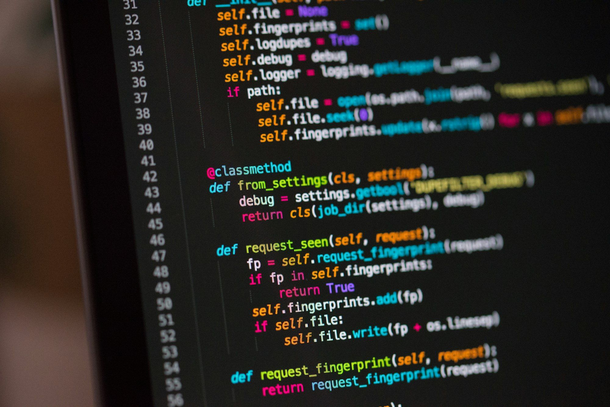 Close-up of Python code in a dark code editor on a computer screen
